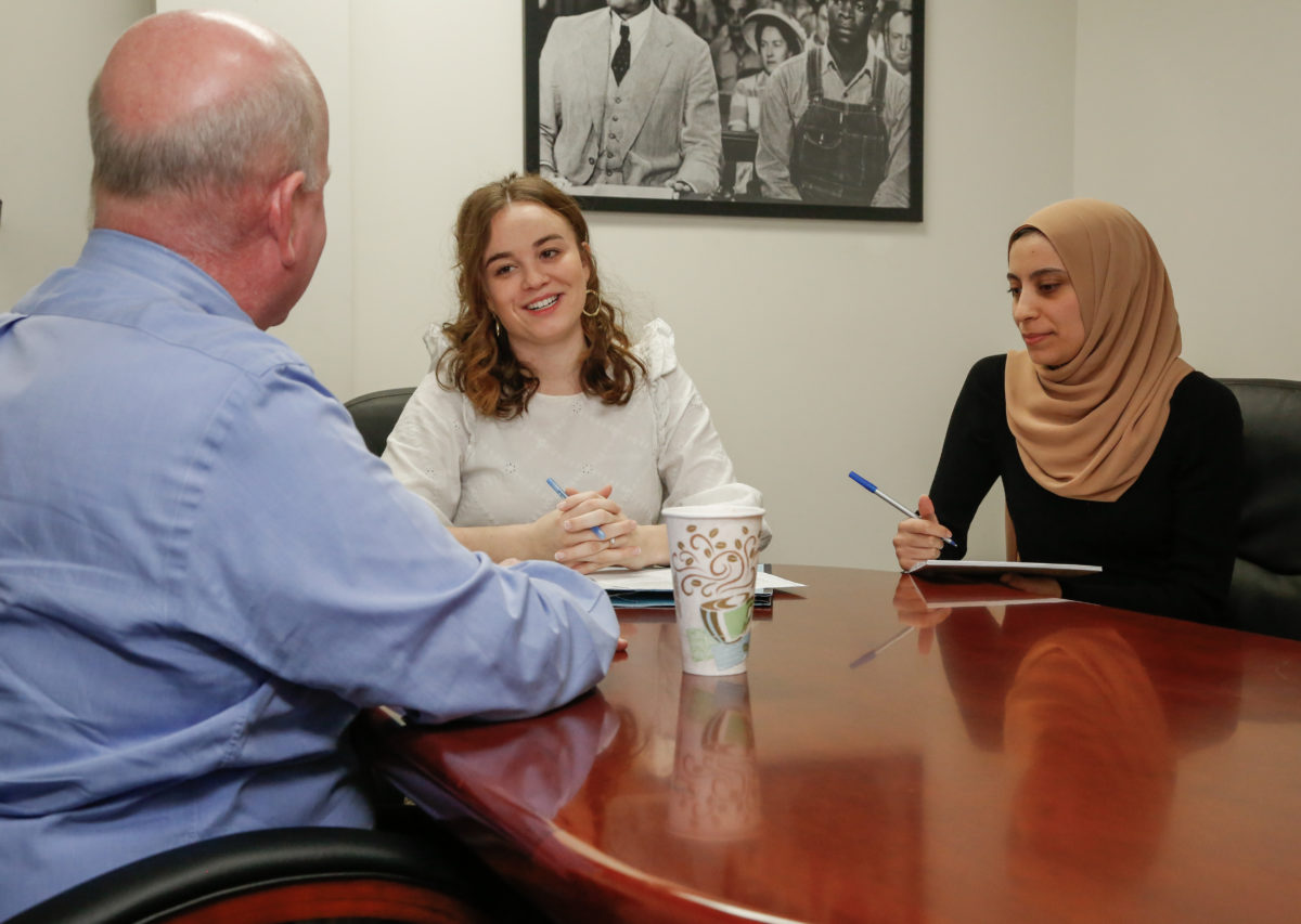  l-r Faulkner Law professor John Craft, and 3L law students Whittney Clark and Wala Hijaz pose for a mock consultation at the Faulkner Law Elder Law Clinic.