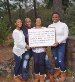 Tucker Family Holding Framed Quote in Woods