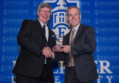 President Mitch Henry awards Jeremy Vest during the 2025 Marketplace Faith Friday Forums.