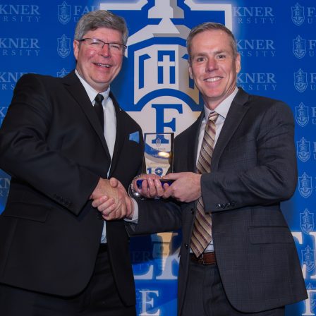 President Mitch Henry awards Jeremy Vest during the 2025 Marketplace Faith Friday Forums.