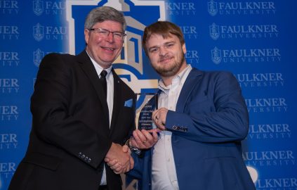 Josh Guy is awarded Accomplished Alumnus during the 2025 Marketplace Faith Friday Forums.