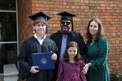 l-r Karson Oakley, left with his parents Kasey and Jessica and sister, Audrey after the graduation ceremony.