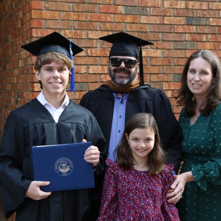 l-r Karson Oakley, left with his parents Kasey and Jessica and sister, Audrey after the graduation ceremony.