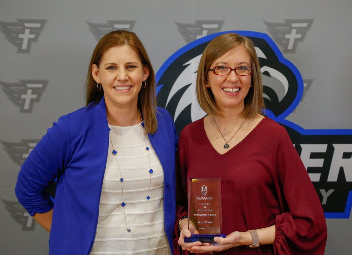 Taryn Brodie stands with Dr. Leslie Cowell, Dean of College of Education.