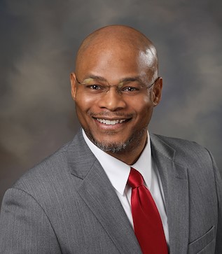 Yearbook Photo of Man with Glasses in Suit