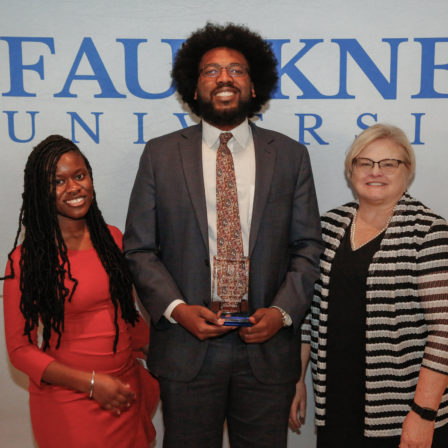 Center, Ahmad Smith stands with his Mia Jones, left, and Cathy Davis after being awarded Accomplished Alumnus for his role as Deputy DA in Montgomery County.