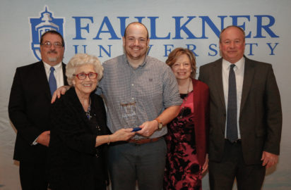 Center, Drew Phillips stands with l-r, Dr. Jeff Arrington, Dr. Elsa Price and his mom and dad, Pat and Steve Phillips.