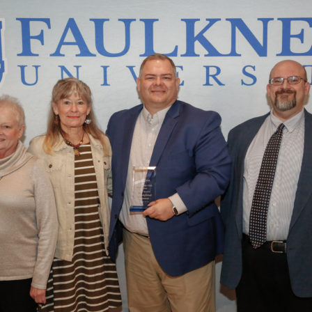 Paul Spurlin, center, stands with his family and Dr. Todd Brenneman. Spurlin is the connections minister at Piedmont Road Church of Christ.