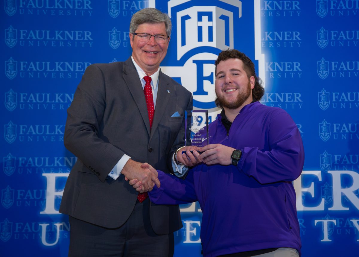 Riley Hall is given the Accomplished Alumnus Award during the 2026 Marketplace Faith Friday Forums. 