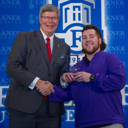 Riley Hall is given the Accomplished Alumnus Award during the 2026 Marketplace Faith Friday Forums.
