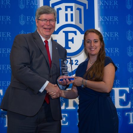 Moriah Hagel accepts the Distinguished Alumna Award.