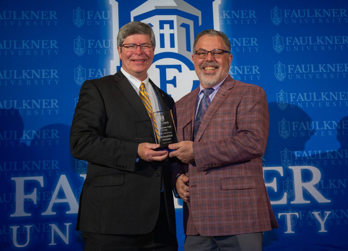 President Mitch Henry awards Scott McCown with Distinguished Alumnus Award. 