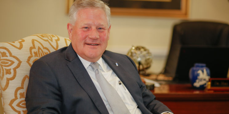 Mike Williams sits in his office.