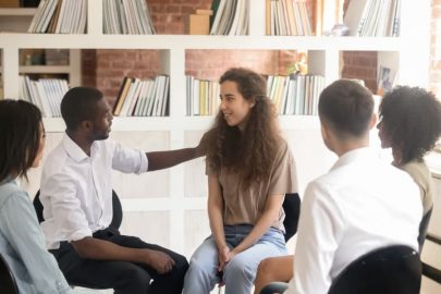 Leader showing compassion to therapy group