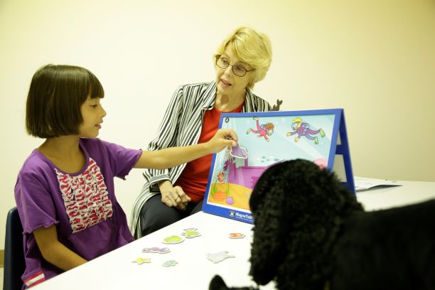 Dr. Sheela Stuart works with young patient Olivia at Faulkner University's new Speech and Language Pathology Clinic on Aug. 3.