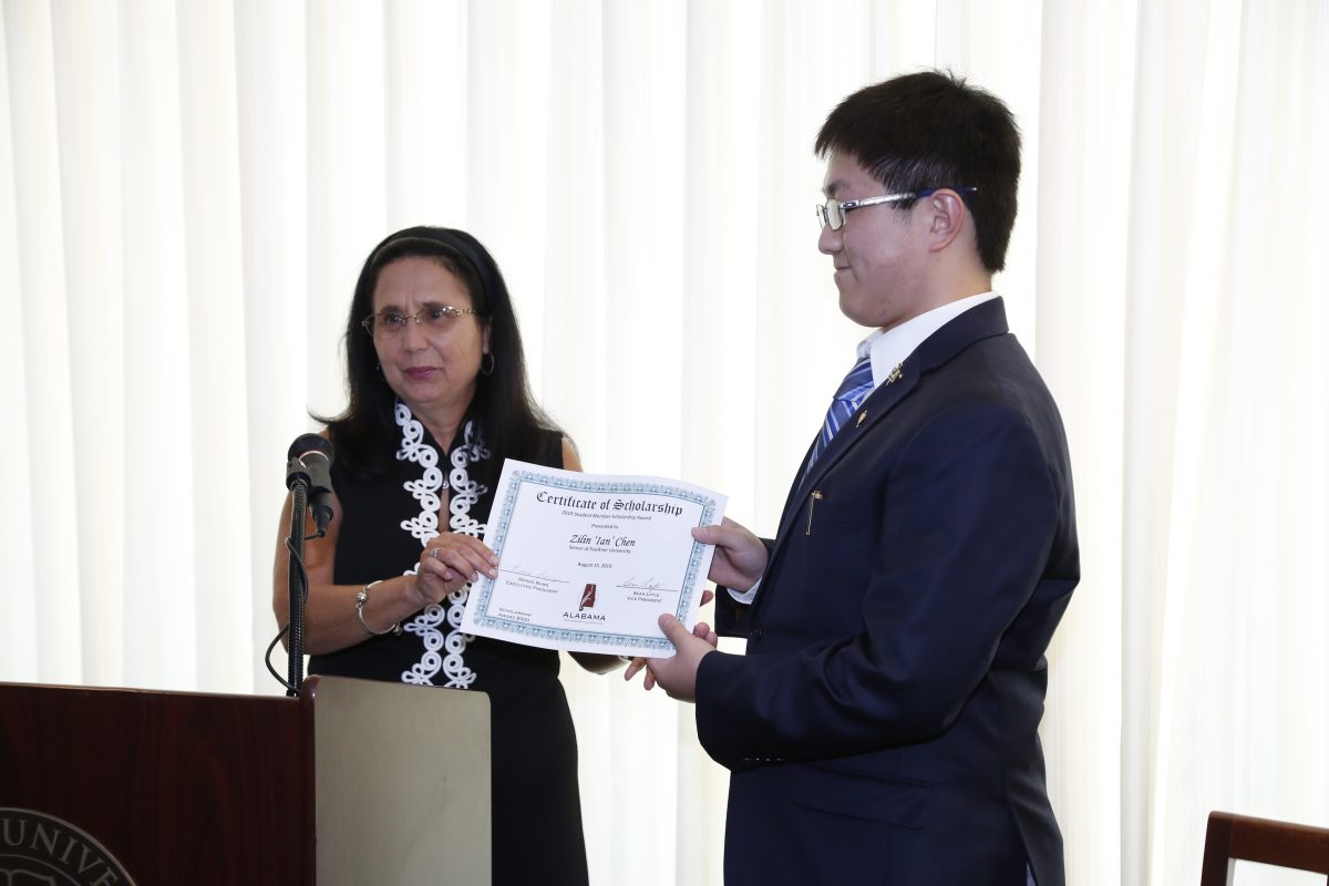 Renee Borg presents the ATF Student Member Scholarship to Faulkner student Zilian "Ian" Chen