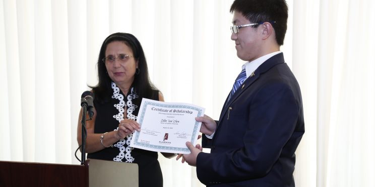 Renee Borg presents the ATF Student Member Scholarship to Faulkner student Zilian "Ian" Chen