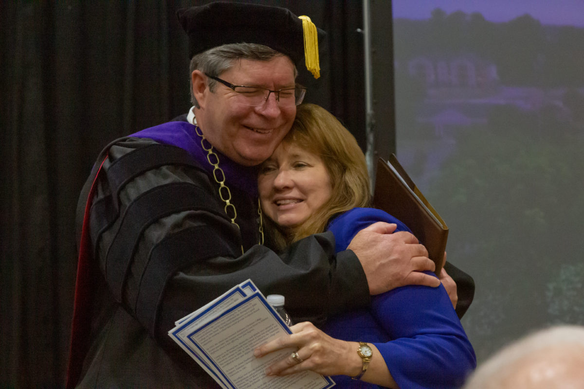 President Henry and wife Cindy Henry embrace following the inauguration ceremony on January 30, 2023.