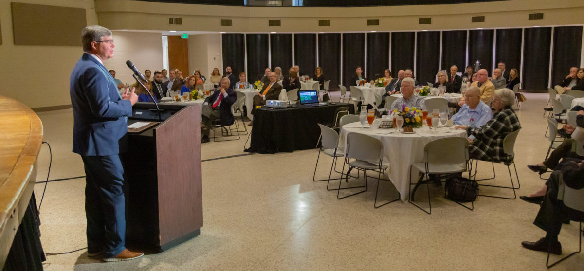 President Henry addresses the crowd during the President's Circle Luncheon speaking on the spiritual awakening happening on campus.