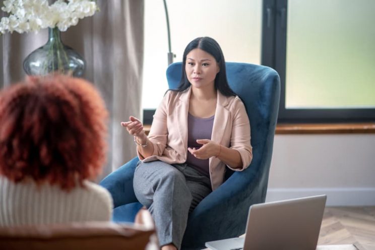 Psychologist speaks with client