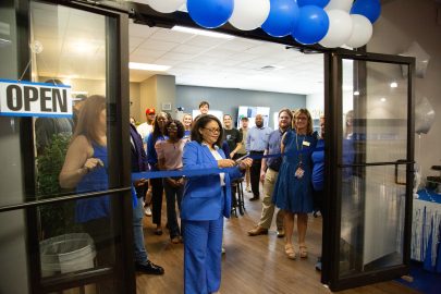 Dawn Chapman cuts the ribbon to open the new Soar Center.