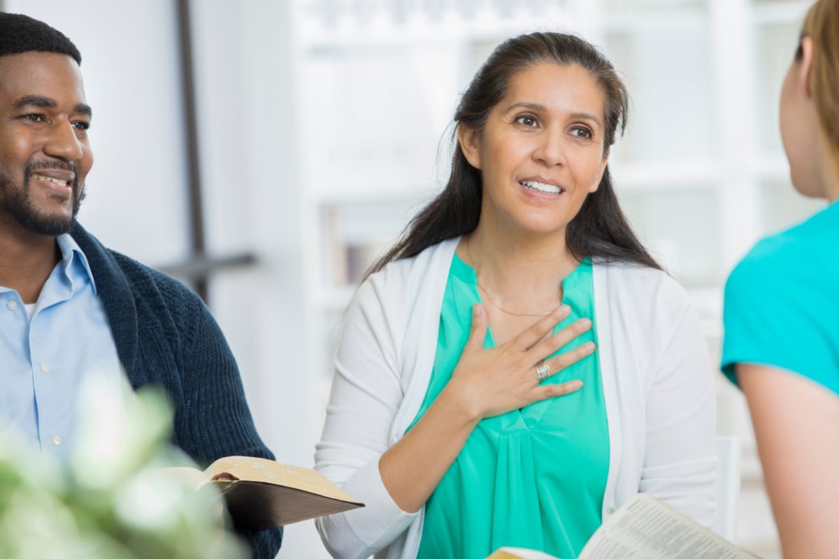 Small bible study group smiles and learns together 