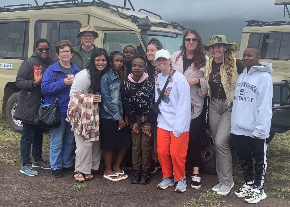 Faulkner students and group leaders, Dr. Rick Trull pose with others during their mission trip to Tanzania. 