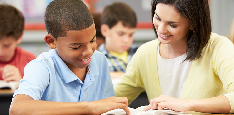 Teacher working with student