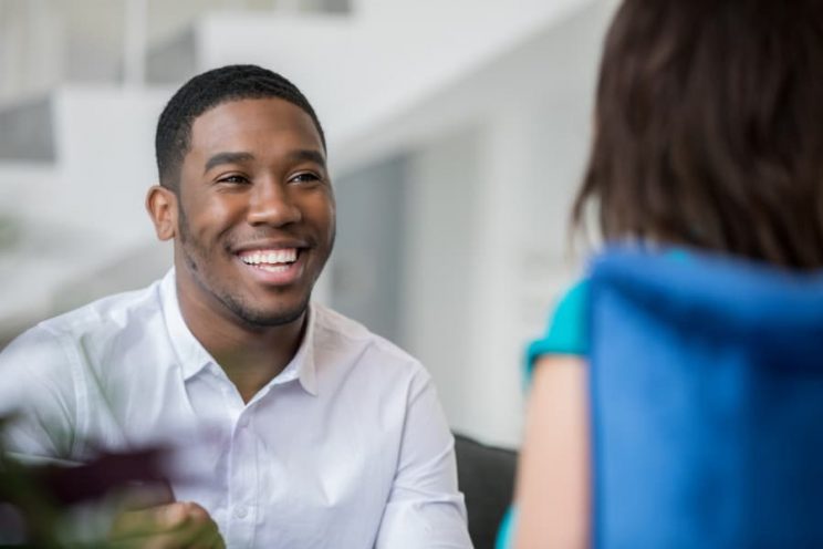 Therapist speaking with patient