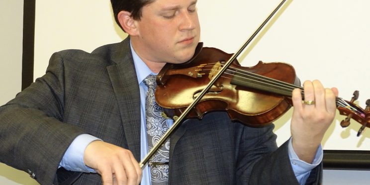 Westley Schlundt plays his violin during the 2019 Marketplace Faith Friday Forums.
