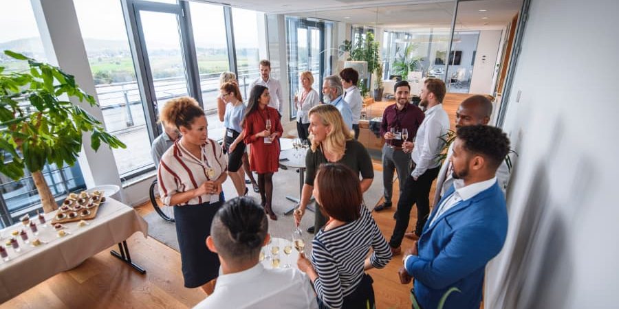 Develop-Social-Skills-with-Online-Business-Networking Business colleagues conversing at gathering