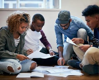 Four College Students Working on a Group Project