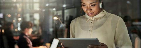 Cropped Image of College Student Looking at Tablet for Project