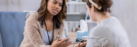 Cropped Photo of Student Talking to Counselor