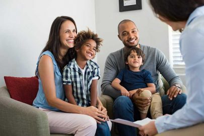 Family Talking to Minister