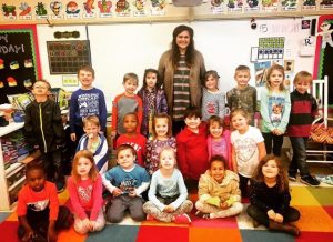 Laura Lambert, center, stands with her kindergarten class at Redland Elementary where she interned and completed her edTPA with