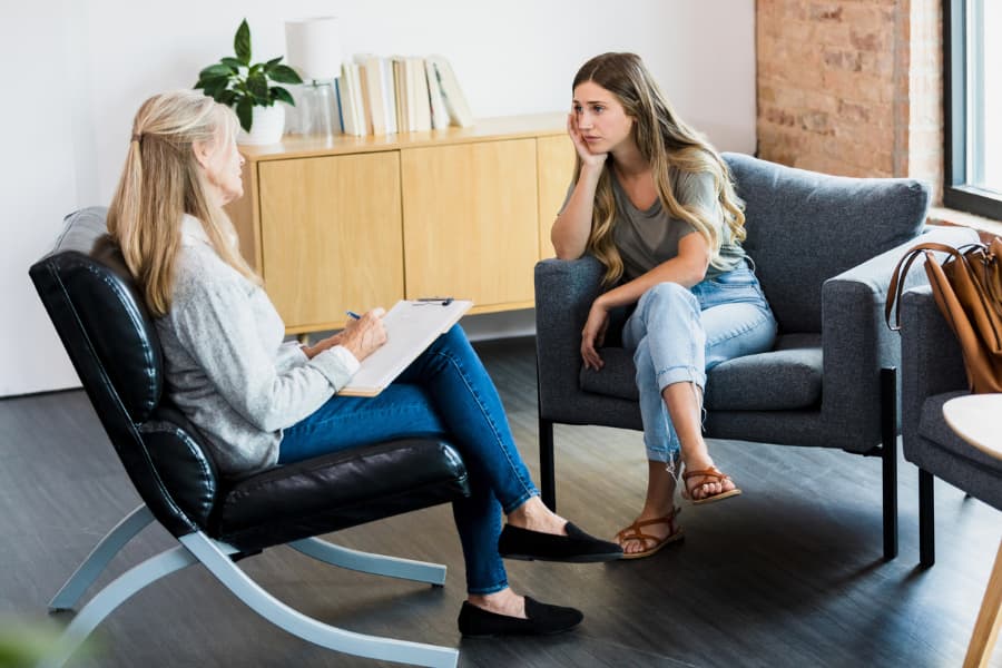 Psychologist talking to a patient during a counseling session