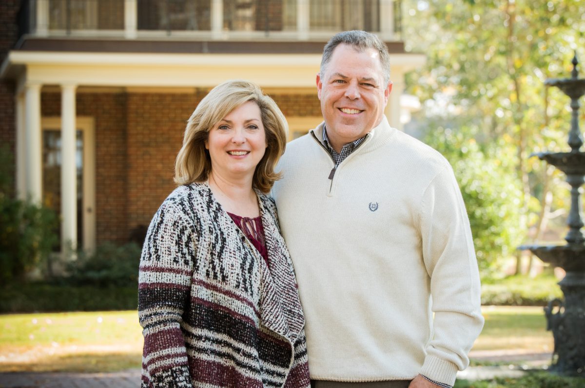 Scott McCown with wife Amy pose outside for a picture. 