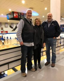 l-r: Tommy Tabor, his wife Robin and alumnus Tim Lee pose before a Faulkner Eagles basketball Homecoming game.