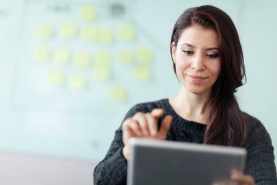 Woman Working on a Tablet